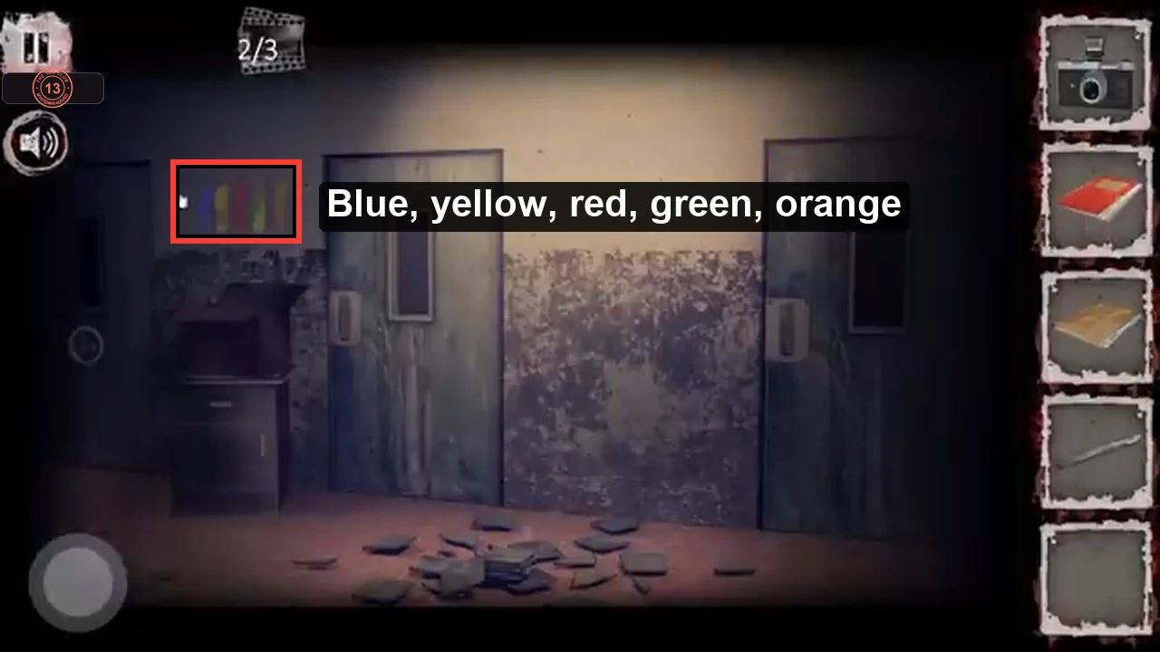 Corridor wall after wiping with coloured stripes revealed and labelled blue, yellow, red, green, orange
