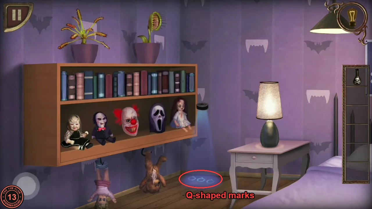 The doll shelf in solved order with the lamp at the shelf end projecting three small Q-shaped rings onto the floor, circled.