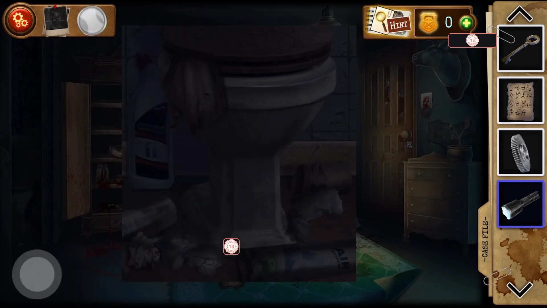 Close-up of the dark upstairs toilet with rubbish piled around its base, with the Working flashlight selected in the inventory