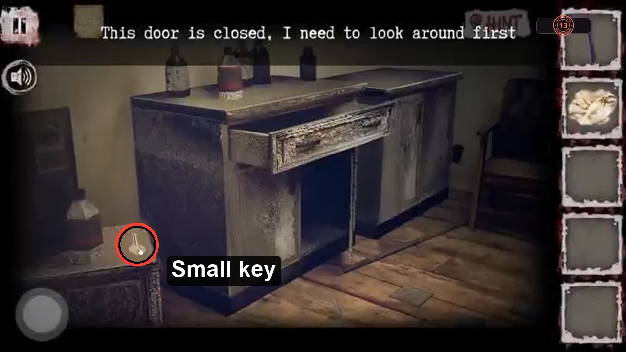 Cabinet close-up with the small key circled on the low cabinet beside a canister