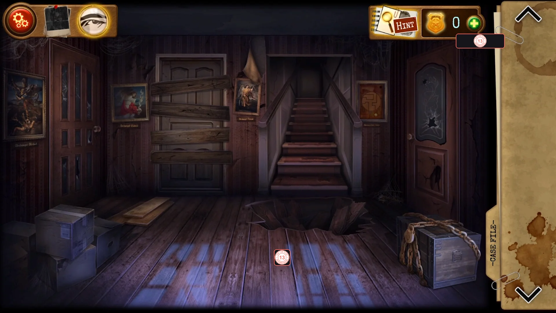 Dark entrance hall with a boarded-up centre door, stairs with a hole in the floor in front of them, cardboard boxes and loose boards on the lower left and a chained chest on the lower right