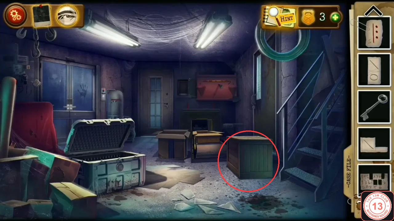 The factory basement with the wooden crate with green side boards circled, right of centre in front of the back wall