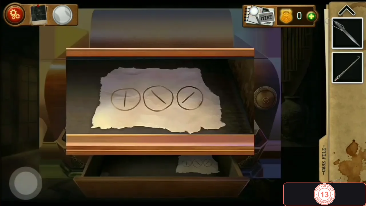 Paper slip in the lower drawer with three circles containing a vertical line, a line from top-left to bottom-right and a line from bottom-left to top-right