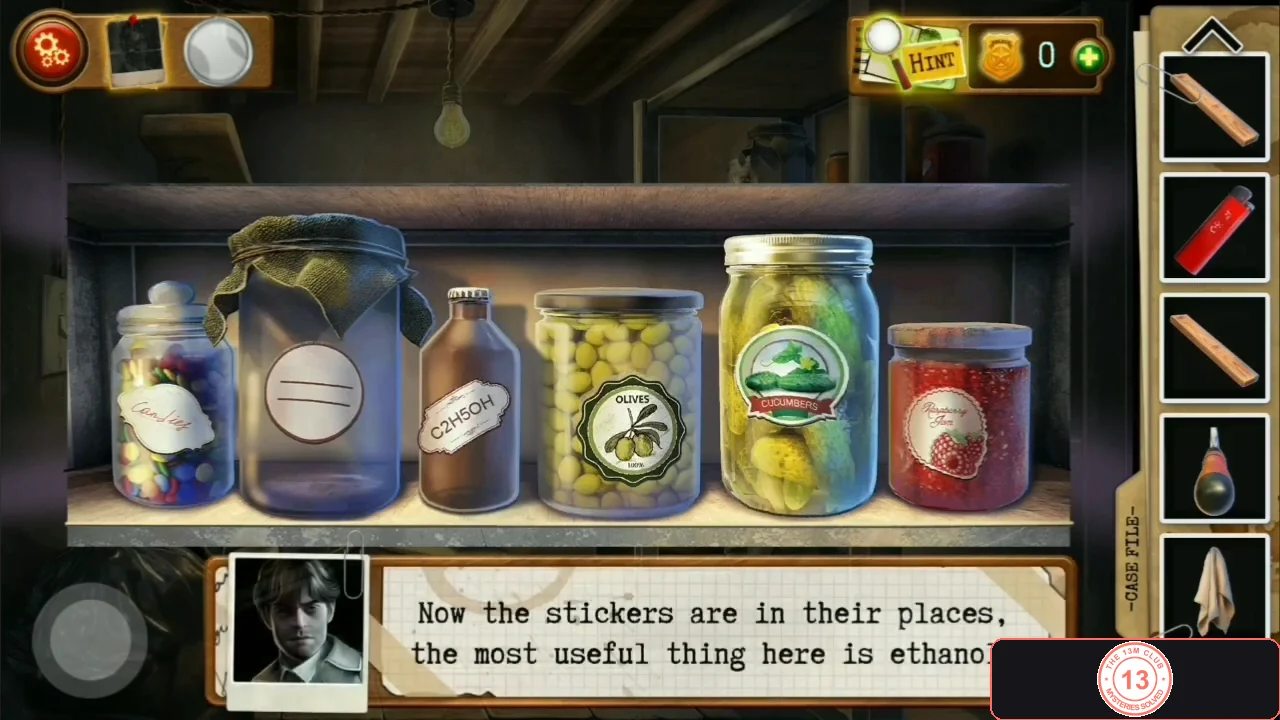 Shelf of jars with matching labels including candy, an alcohol bottle marked C2H5OH, olives, pickles and jam