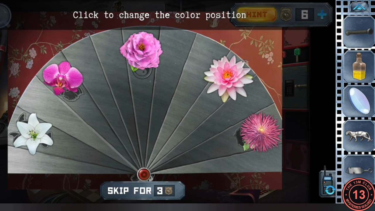 Fan-shaped panel above the living-room bed with five flowers in the wrong places: orchid upper left, peony top, water lily upper right, white lily lower left, chrysanthemum lower right; instruction 'Click to change the color position'