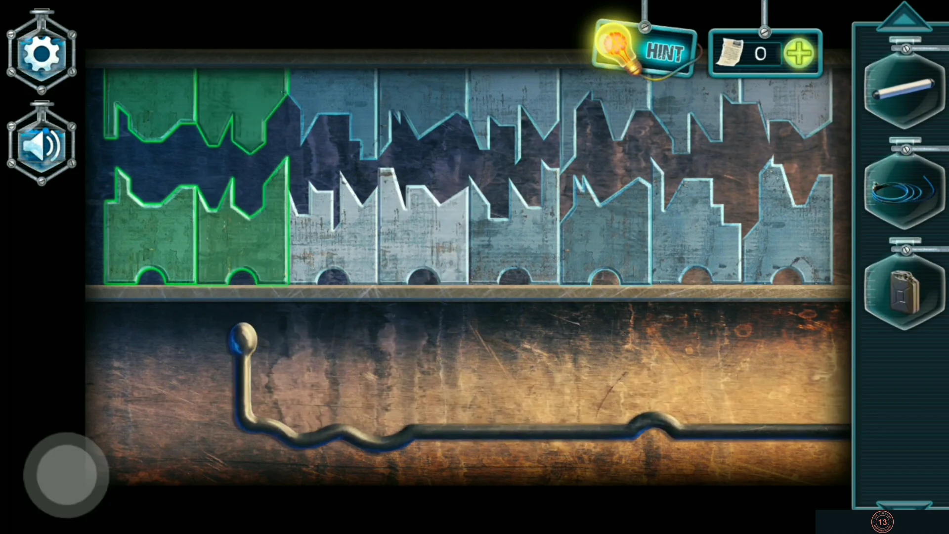 Garage wall safe key puzzle: a row of key teeth below the matching reliefs, two already glowing green