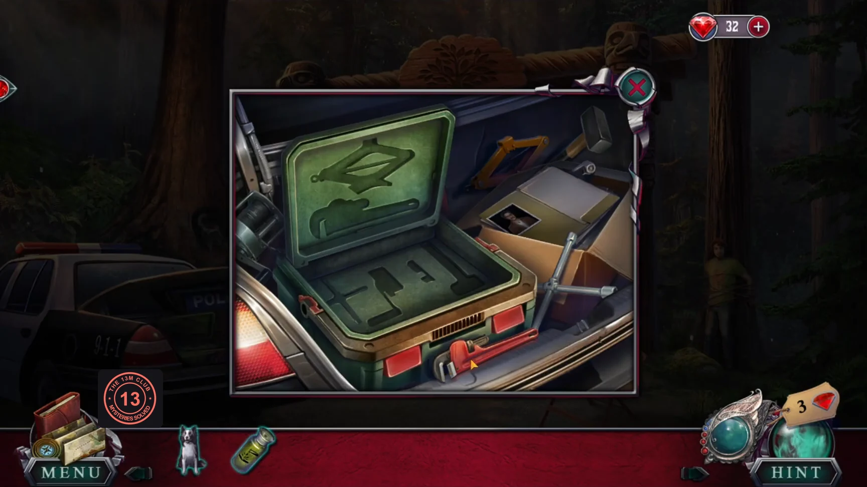 Open toolbox in the police car trunk with empty tool outlines and the loose tools around it