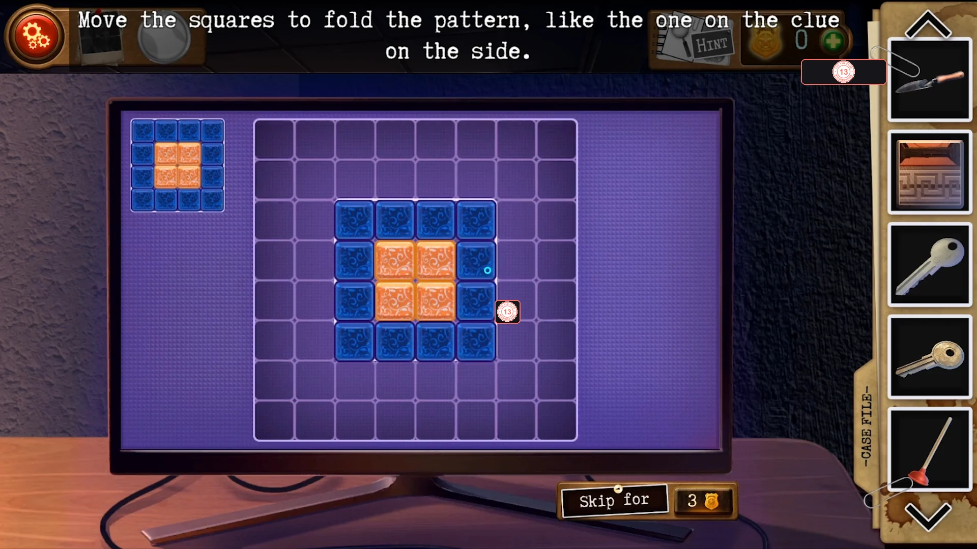 Solved grid: four orange squares in a 2x2 block surrounded by a ring of twelve blue squares, matching the clue