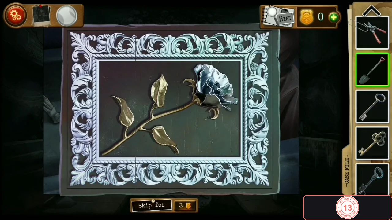 The completed picture: an ornate silver frame around a single silver rose with golden leaves