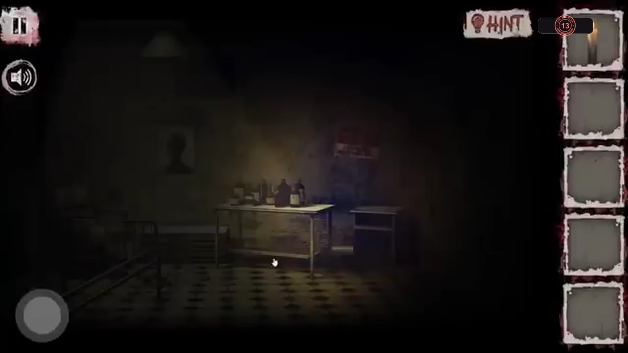 Dim ward behind the green door with a bed, a table and a portrait on the wall