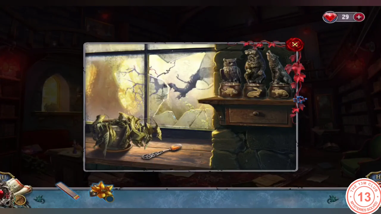 Library window shelf with three predator statues above a drawer