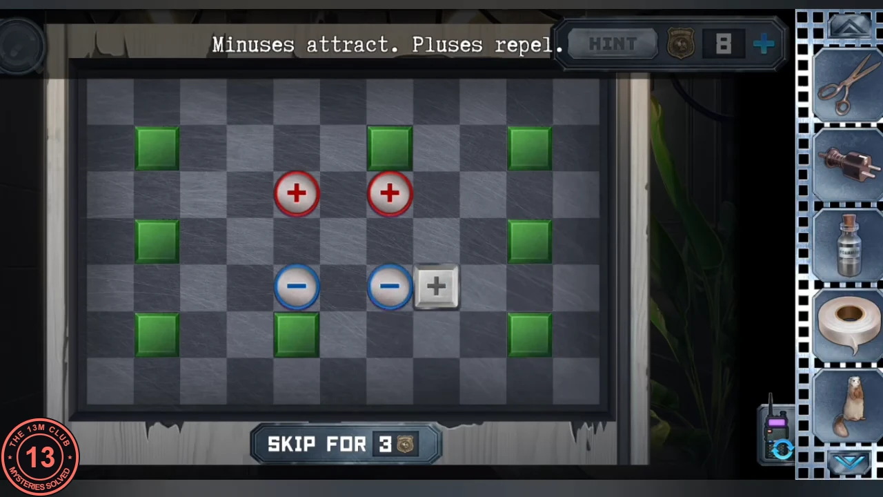 Magnet board with green blocks around the edge; two red plus magnets and two blue minus magnets form a square in the middle, with the grey plus block beside the right minus magnet, instruction 'Minuses attract. Pluses repel.'