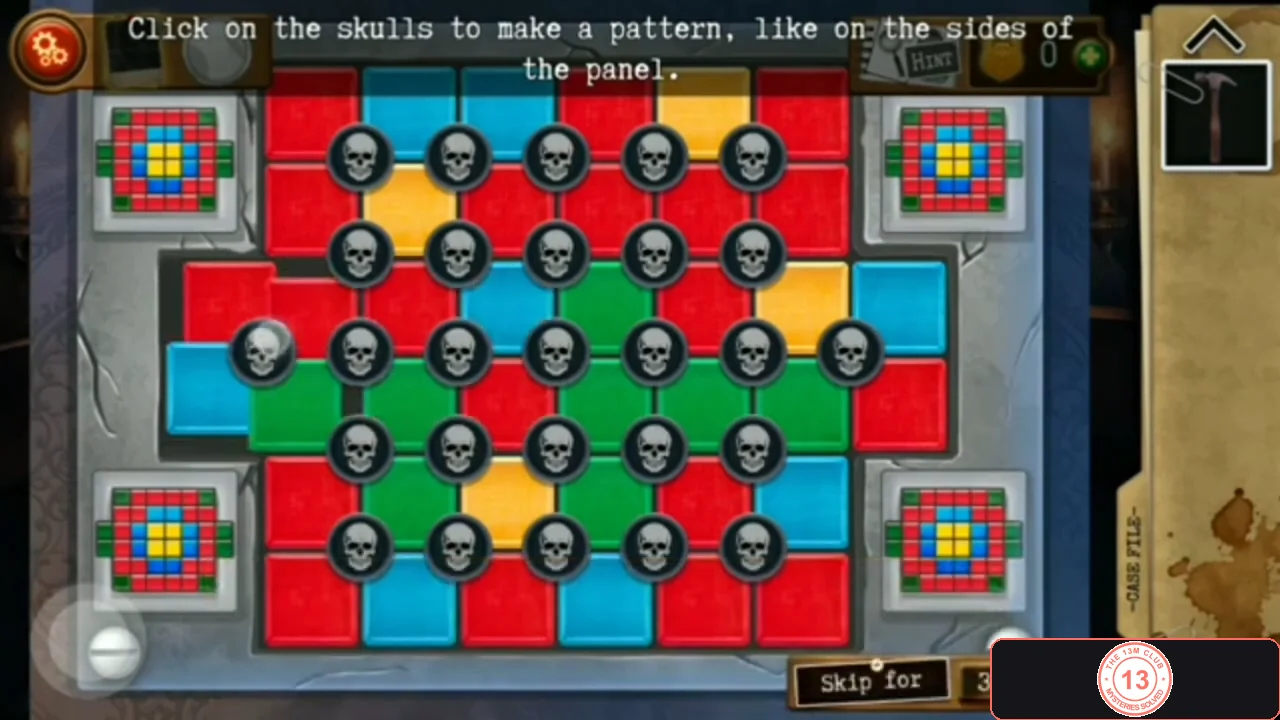 Skull panel of red, blue, yellow and green tiles with small target patterns in the four corners