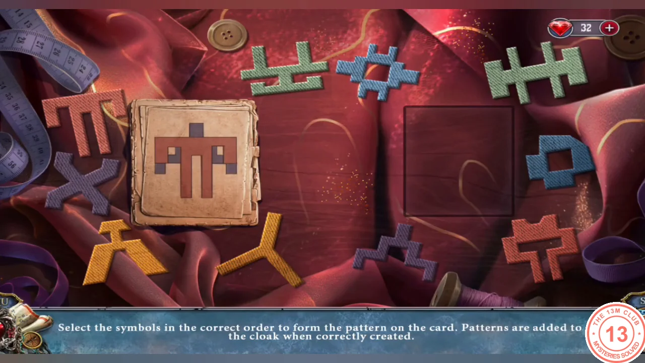 Red cloth with colored stitch symbols scattered around and the bird pattern card on the left