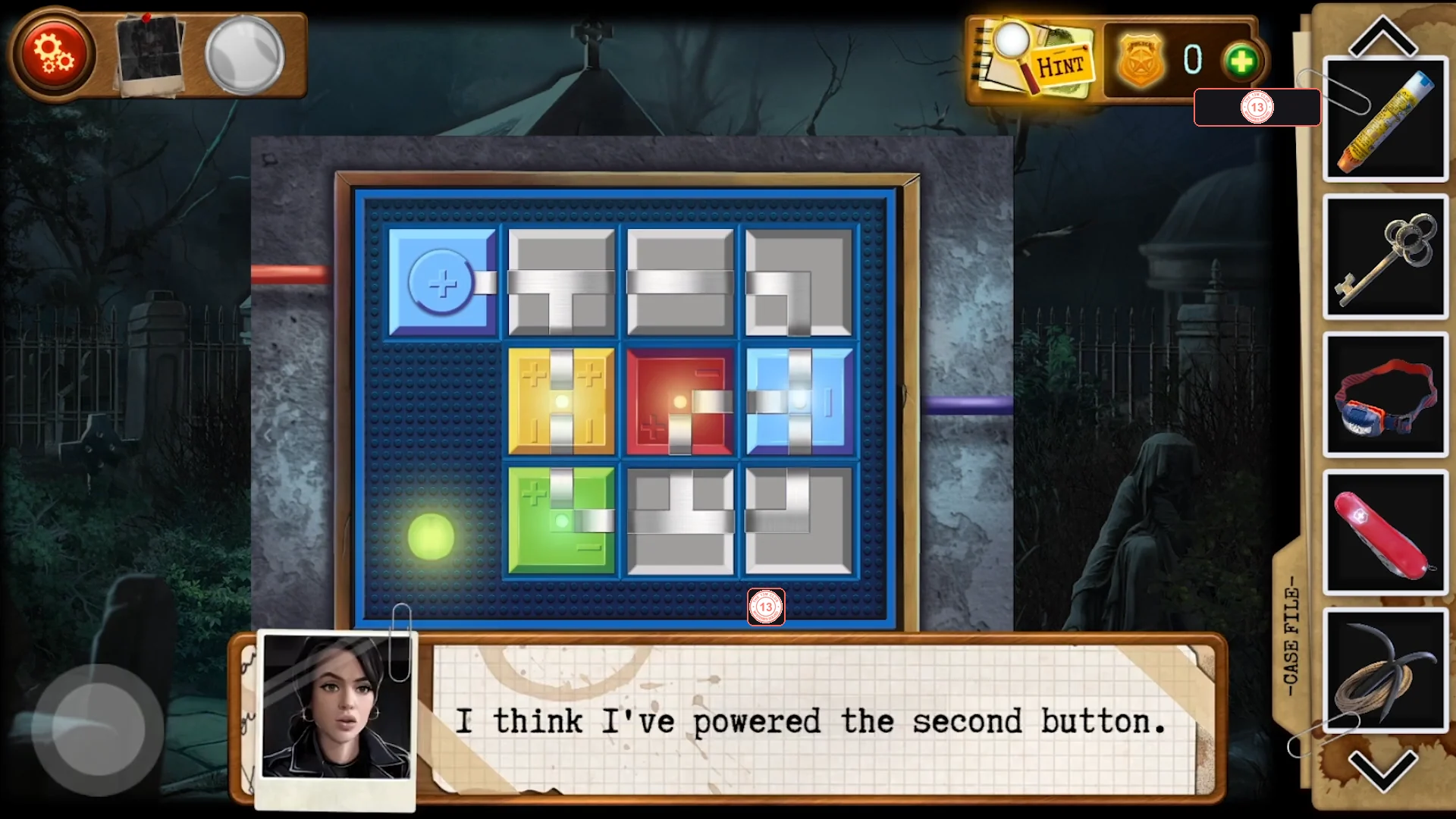 One solved circuit layout with the path running from the blue start tile through the coloured tiles and the green light at the lower left lit