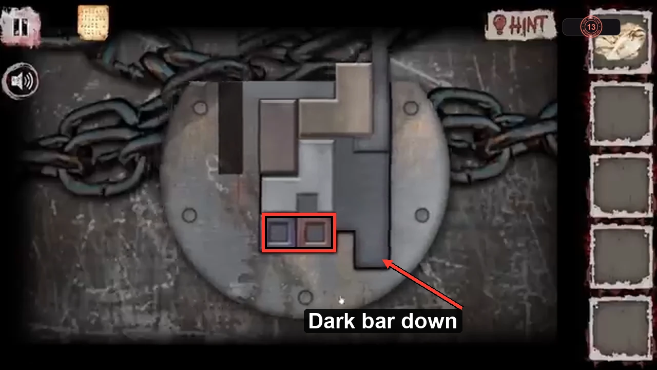 Solved sliding lock with the two small squares outlined at bottom left and an arrow at the dark bar in the bottom-right notch