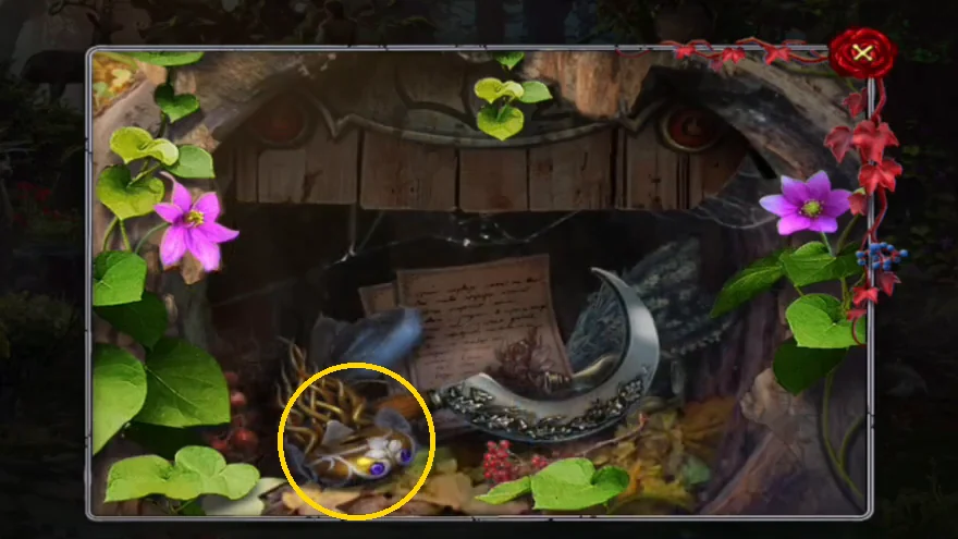 The opened hollow behind the oak leaf plate: pages at the back, a sickle on the right and the gold broken artifact with a purple gem circled at the lower left