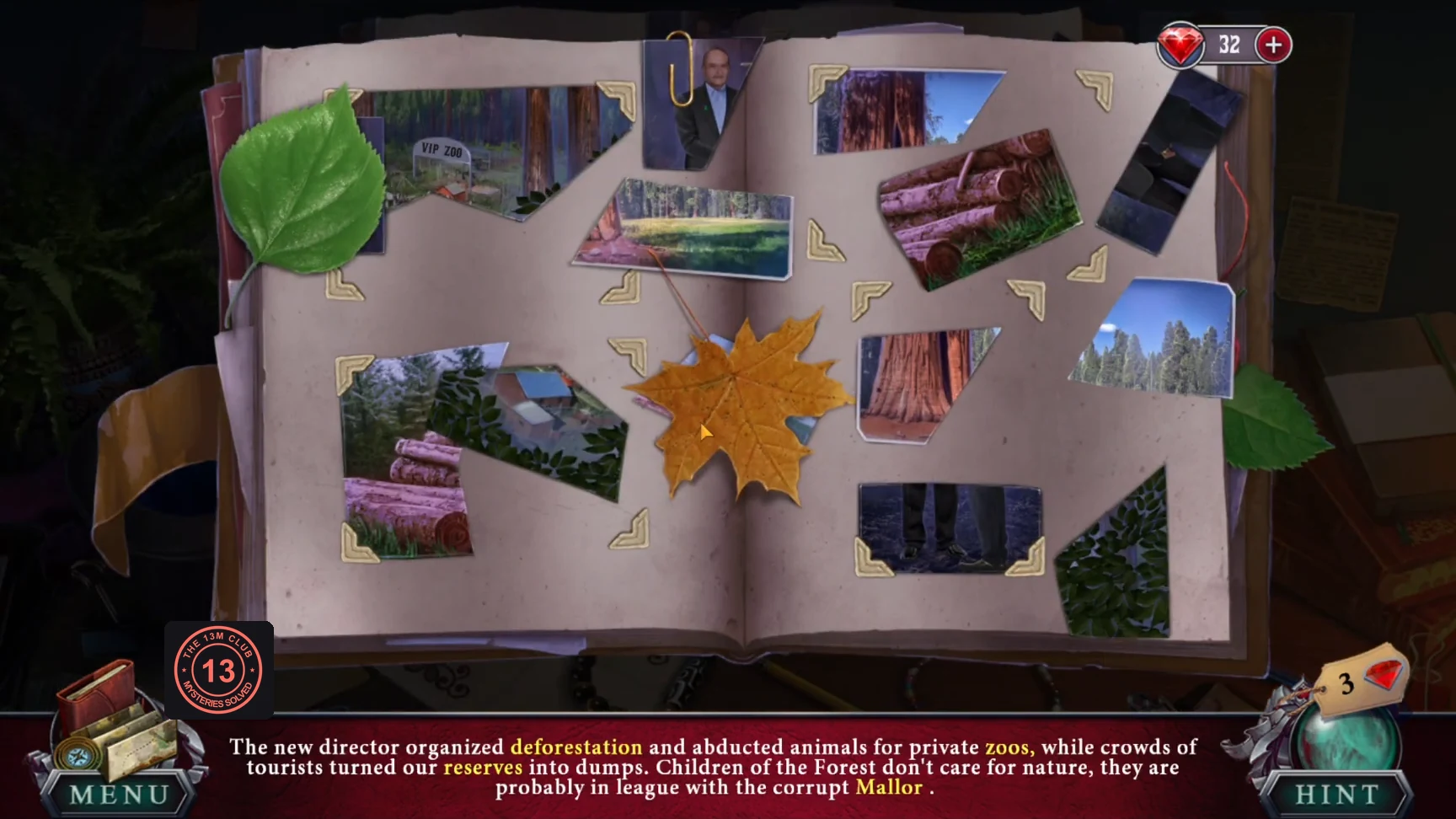 Diary spread with torn photo pieces, paperclips and leaves