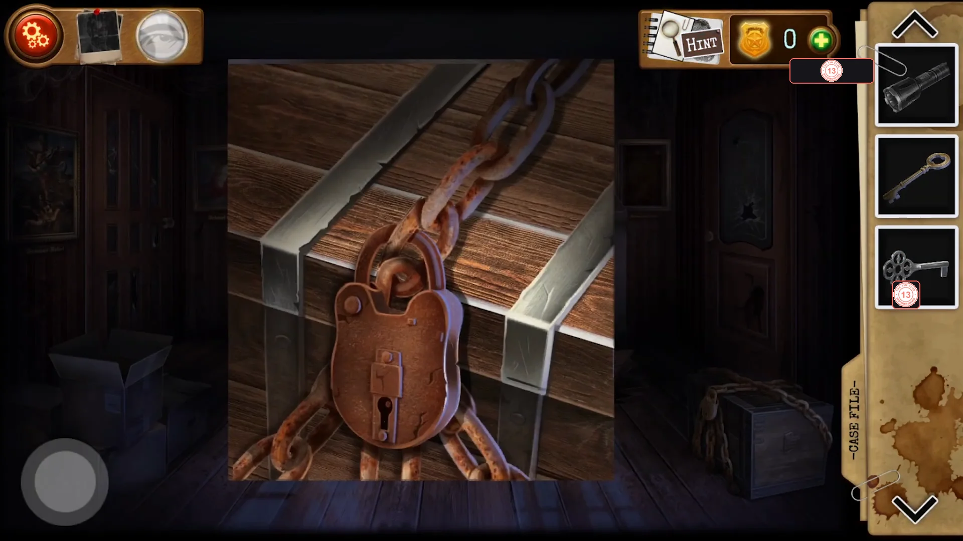 Close-up of the chained wooden chest in the hall with a large rusty padlock