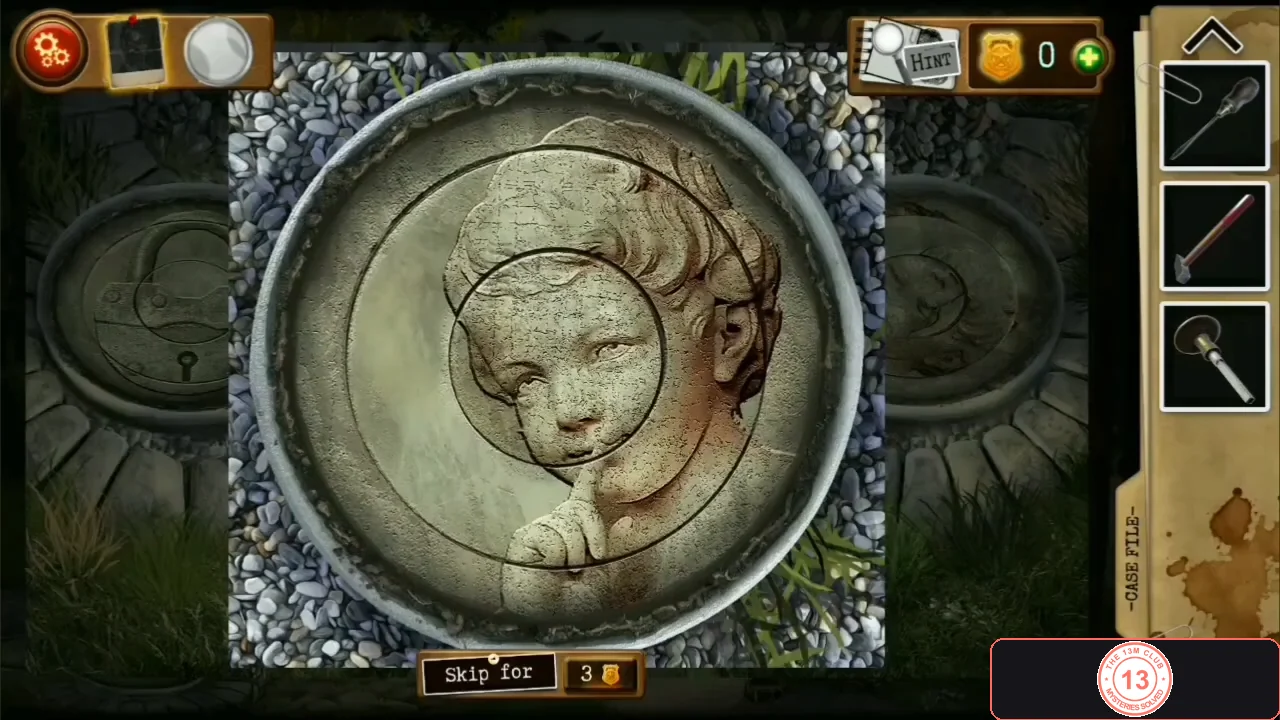 Round carved stone disc with its rings turned so the picture shows a cherub holding a finger to its lips