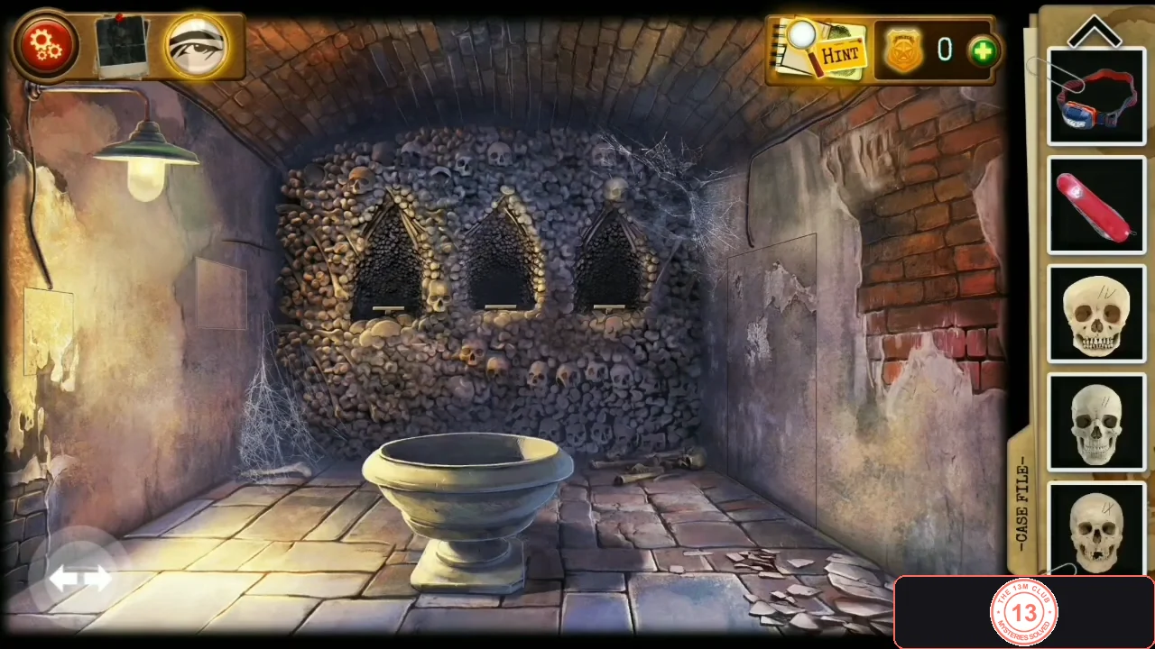 Vaulted room of stacked skulls with a stone basin in the middle and three arched alcoves in the back wall