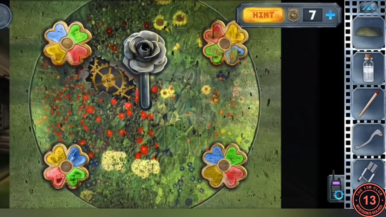 The flower lever in the clearing: four four-petal flowers with blue, green, yellow and red petals around the golden gear and the metal rose lever.