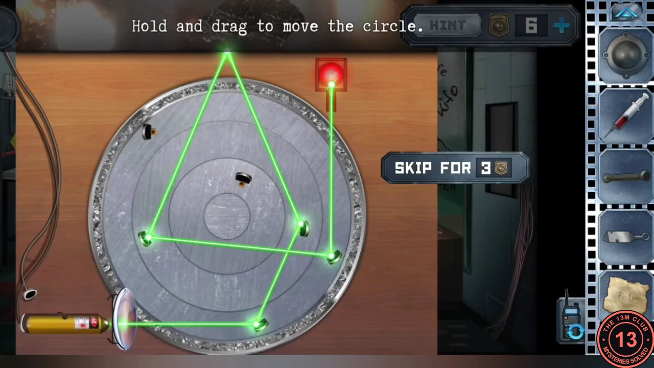 The laser puzzle solved: the green beam bounces between several mirrors around the plate and ends on the lit red button at the top right