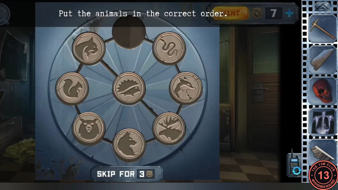 The ring lock on the blue hospital door: eight animal tokens on a wheel with the hedgehog in the centre and the top slot empty, and the instruction to put the animals in the correct order.