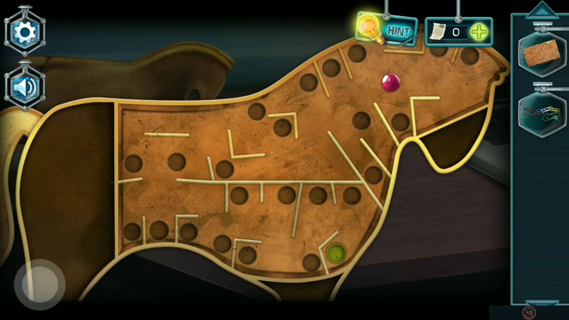 Ball maze inside the golden Trojan horse with the red ball and the exit hole
