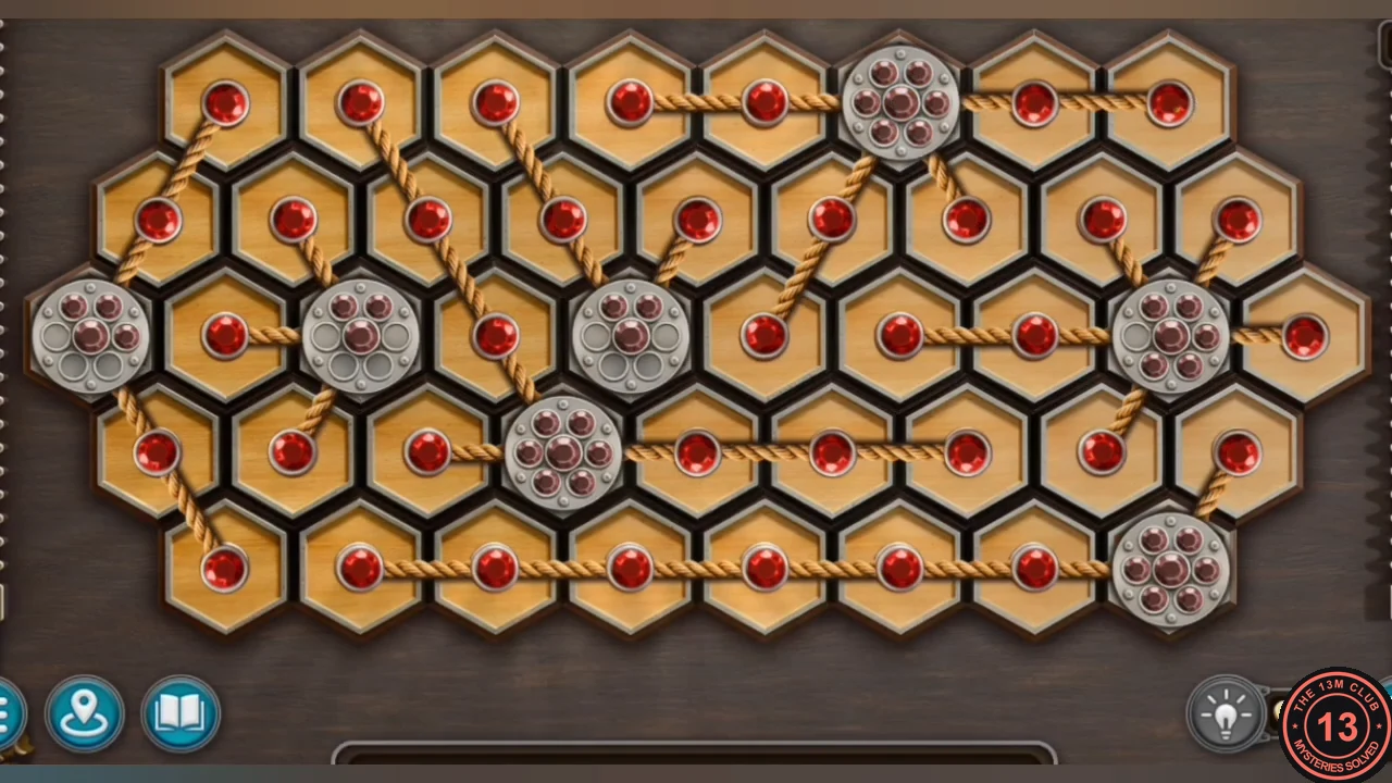 Completed rope puzzle with every hole filled by red beads
