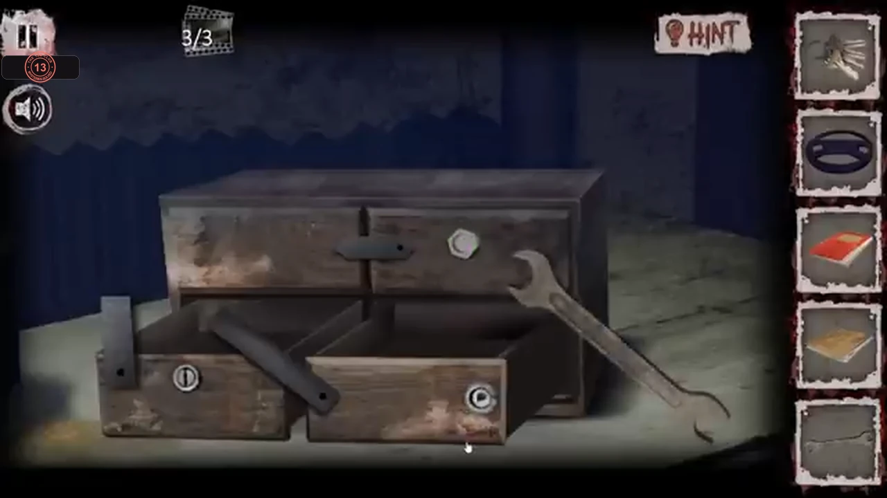 The drawer chest with the wrench on the hex bolt at its top right