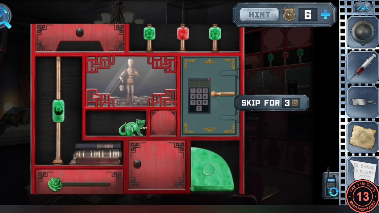 Red living-room bookshelf with two green and one red lantern at the top, a green bird on the left pole, a green rose on the bottom bar, a jade cat in front of a locked keypad safe, and the pulled-out green surface at the bottom right.
