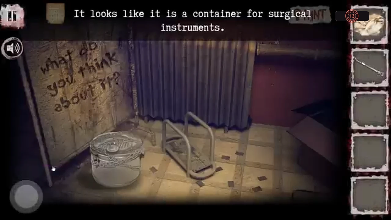 Corner of the surgical room with the chained instrument container and writing on the wall