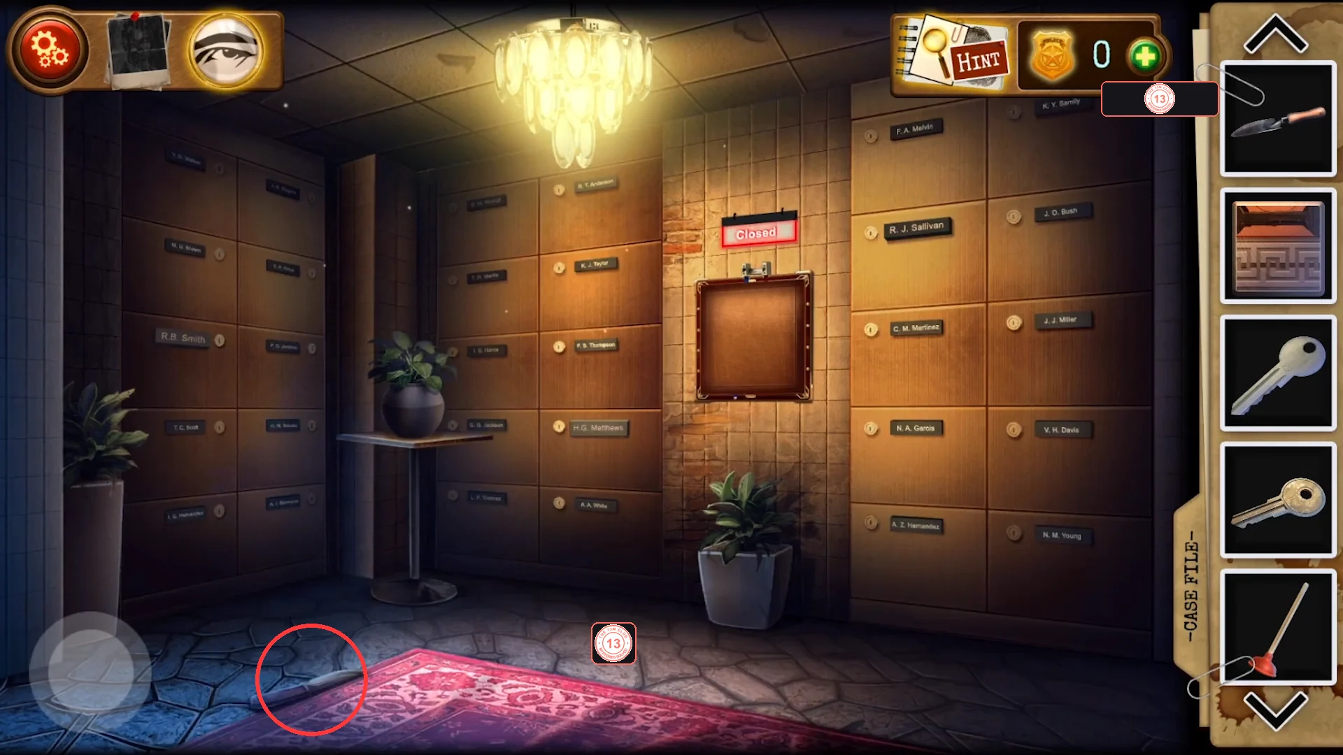 Inside the vault: walls of named deposit boxes, a covered panel under a red Closed sign in the middle and a knife lying on the floor at the lower-left edge of the rug