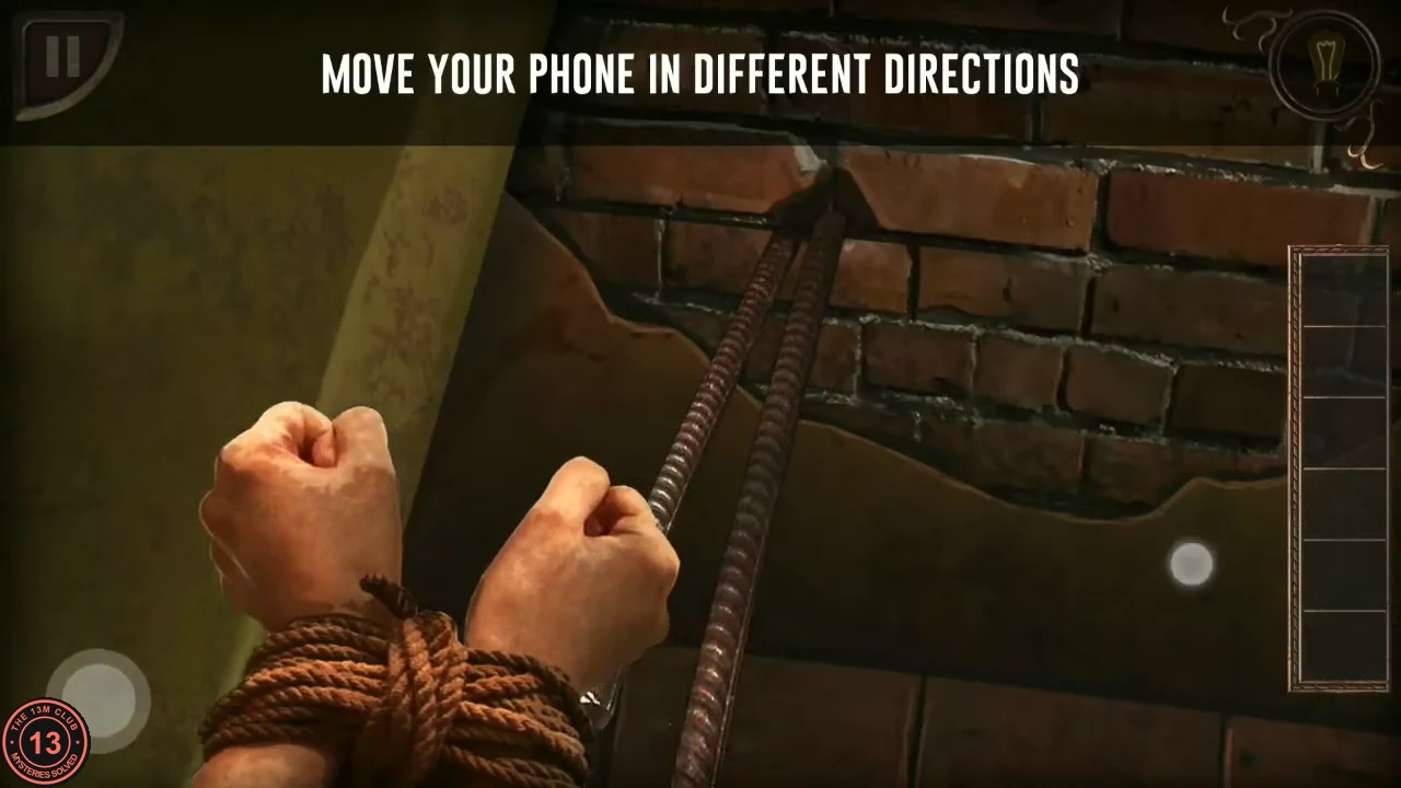 The tied hands rubbing the rope against an iron rod sticking out of the brick wall, with the prompt MOVE YOUR PHONE IN DIFFERENT DIRECTIONS.