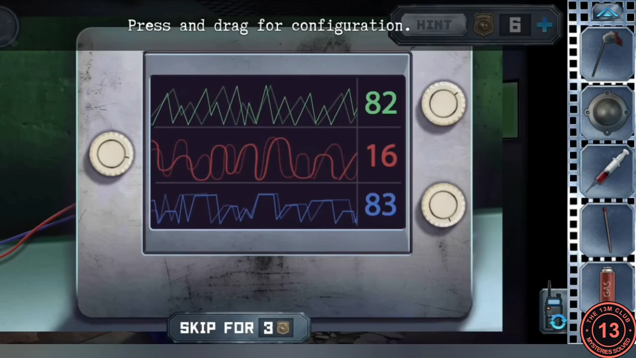 The device on the hospital desk showing three pairs of mismatched waves in green, red and blue with readings 82, 16 and 83, and three round knobs.