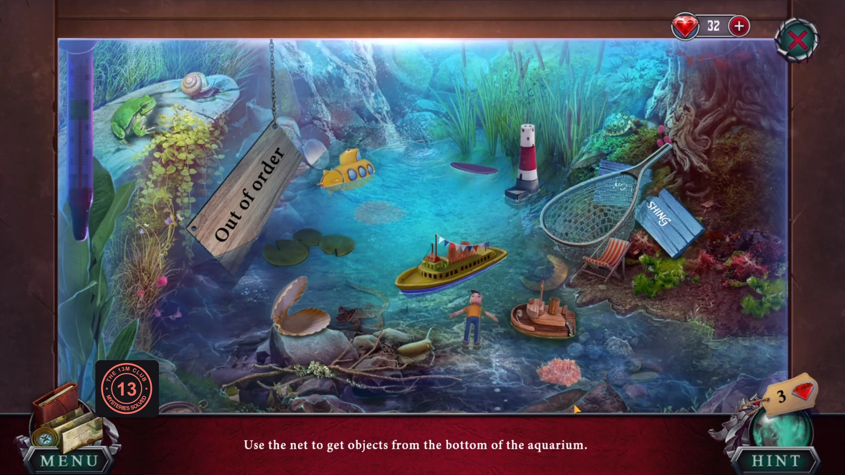 Aquarium with scattered objects on the bottom and the net