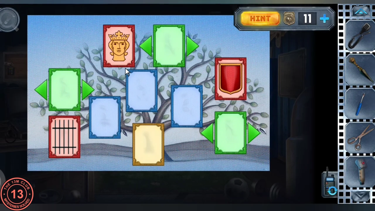 Family tree on the laptop: a red king card, red shield card and red portcullis card, three green cards with arrows, three blank blue cards and a blank gold card on a tree drawing