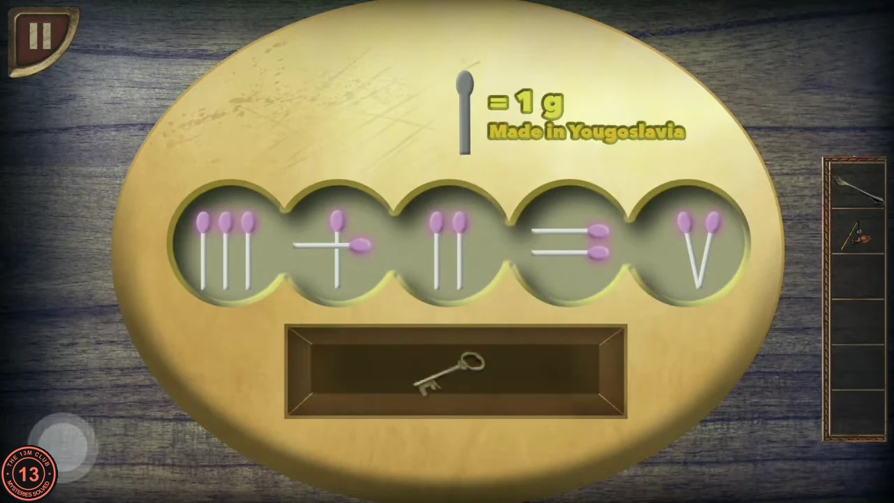 The matchstick panel showing III plus II equals V with the small key in the open tray.