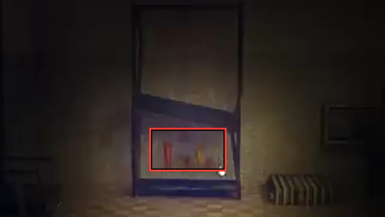 Glass cabinet on the basement wall with five red and yellow bottles of different heights marked