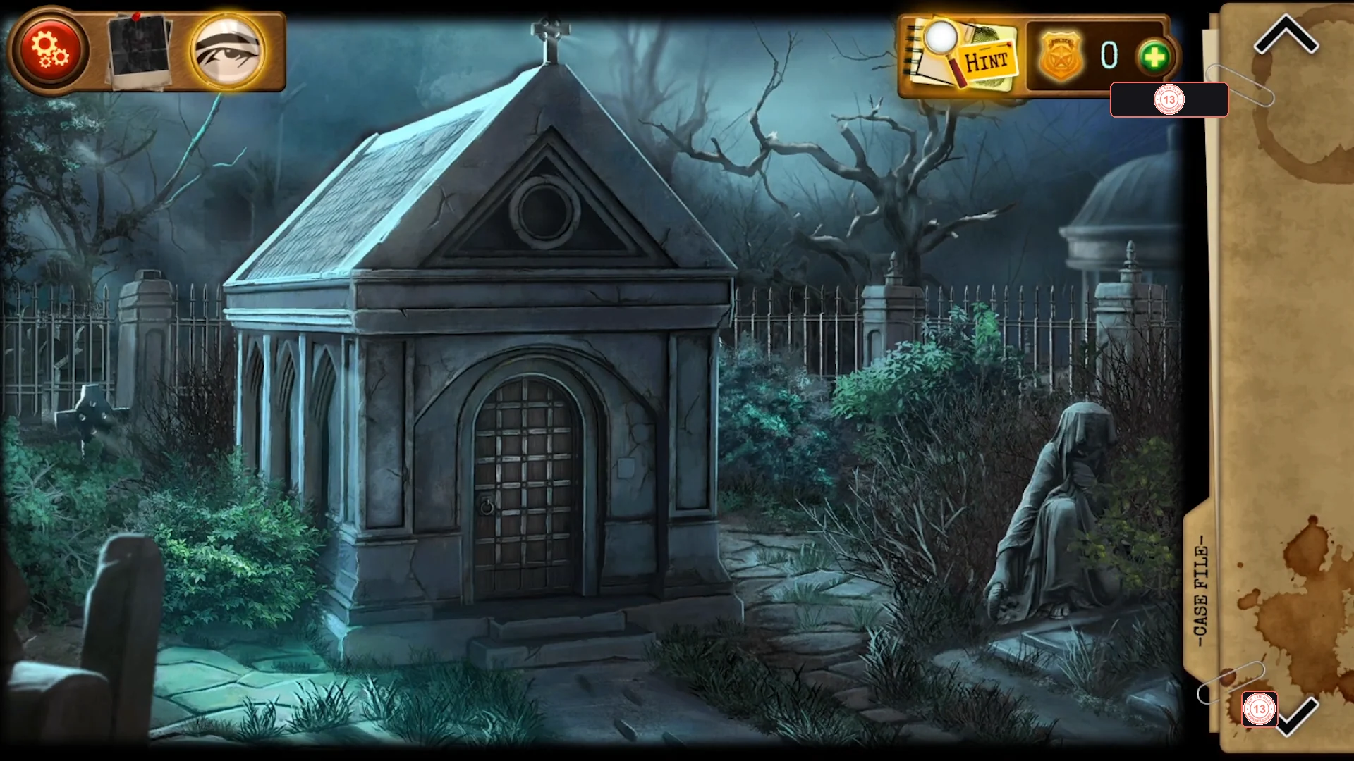 Night-time cemetery with a small stone mausoleum and its barred wooden door, a fence on the right, a hooded statue and a vine-covered slab at the lower left