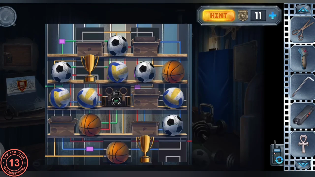The cabinet shelves after the circuit was completed, with the balls, trophies and boxes in their final positions around the camera device