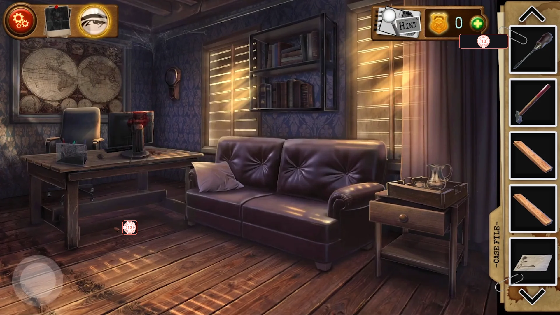 Chester's office with a world map, a desk with a blood-spattered monitor, a leather sofa, a bookshelf above it and a bedside table with a drawer on the right