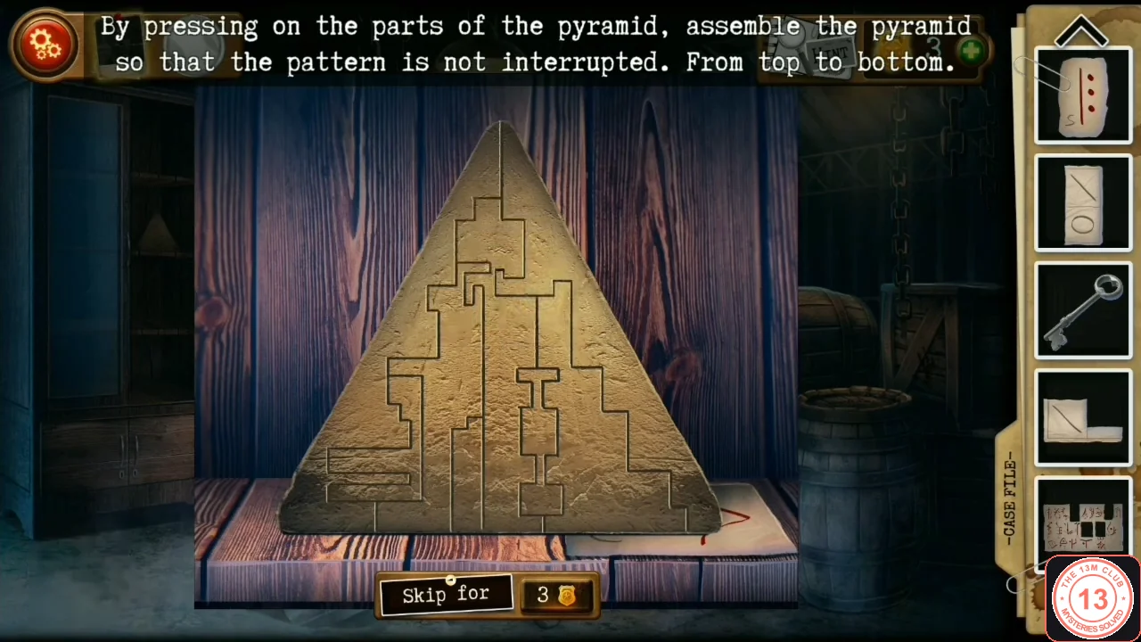 Stone pyramid with all its pieces turned so the carved line runs continuously from the tip to the base