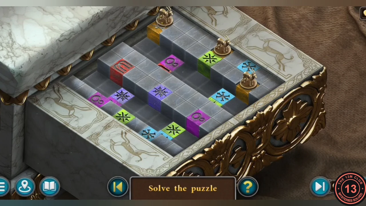 Solved stag puzzle with a bronze stag standing on each of the three gold blocks