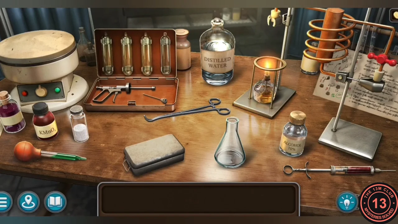 Synthesis table in the main lab with a centrifuge, test tubes, flask, burner, coil and capsule injector