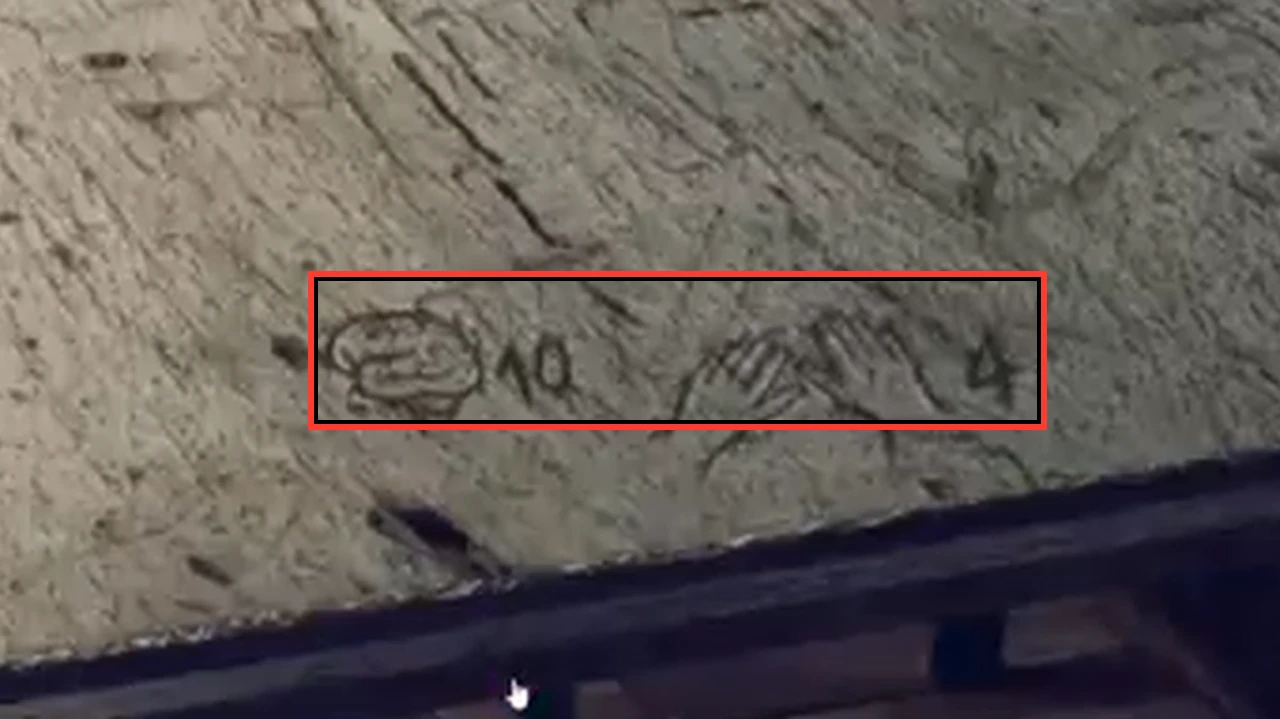 Table top with scratched drawings of a brain beside 10 and a pair of hands beside 4, outlined
