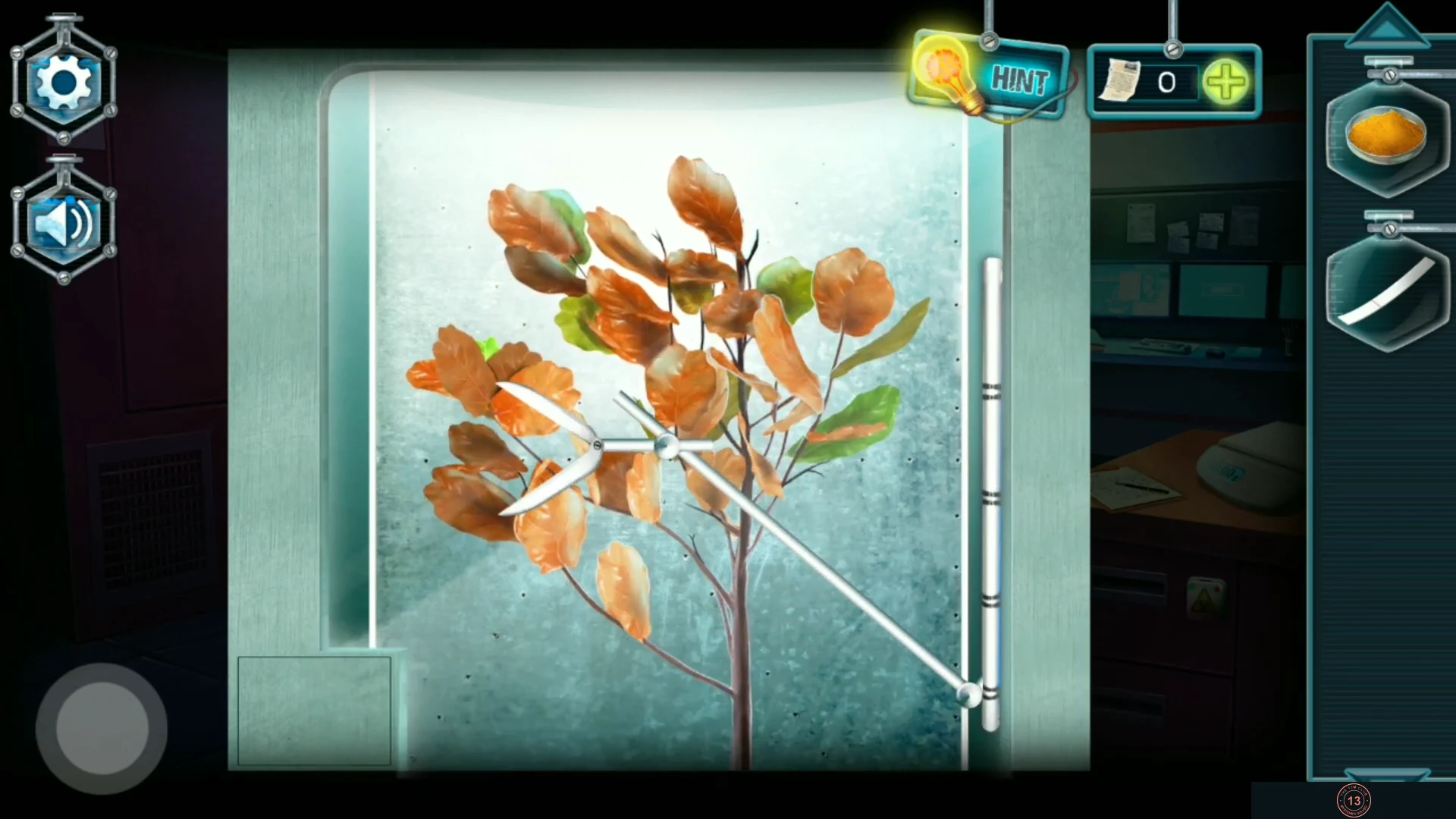 Glass arboretum with the auto-pruner arm and the leaves of the plant