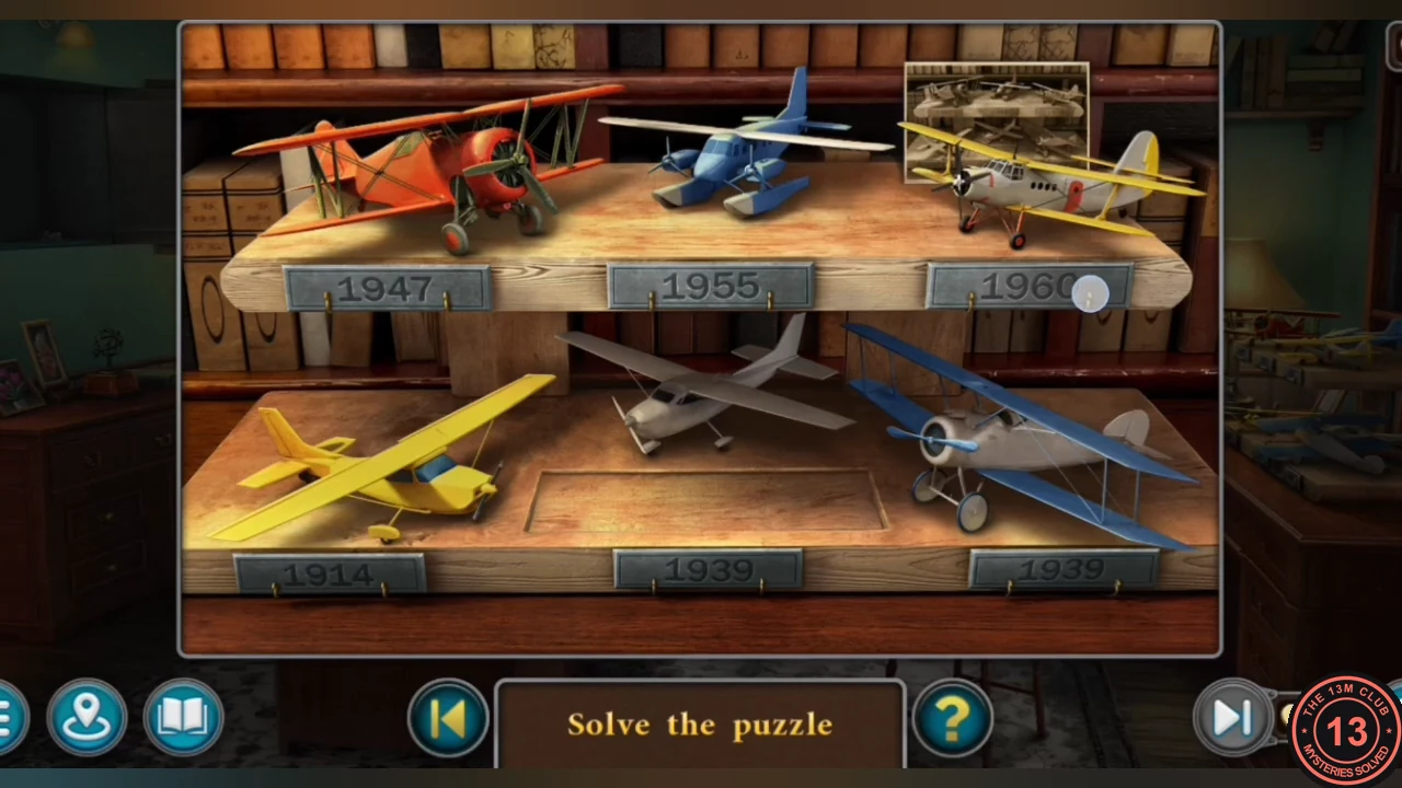 Airplane shelf with six model planes, date plates and the photo at top right