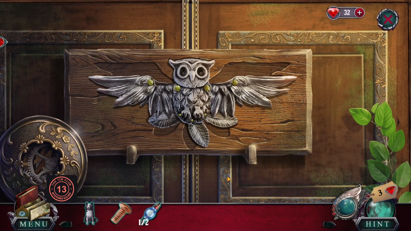 Owl mechanism in the carved recess on the souvenir kiosk doors